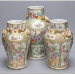 A pair of 19th century Chinese famille rose vases, height 30.5cm and a similar larger vase, 37.