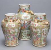 A pair of 19th century Chinese famille rose vases, height 30.5cm and a similar larger vase, 37.