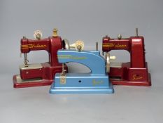 Three vintage Vulcan hand sewing machines