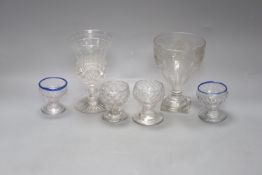 Four 18th century sweetmeat glasses, two with applied blue cable, a George III rummer and an 1842