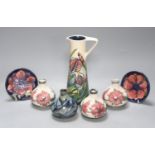 A Moorcroft iris pattern jug and two anenome dishes, together with four Cobridge vases