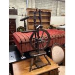 A provincial turned beech spinning wheel, height 100cm