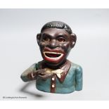 A cast iron figural money box