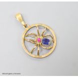 A 9ct, sapphire and ruby set circular spider pendant, 19mm, gross weight 1.9 grams.