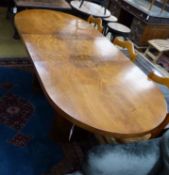 An Art Deco figured walnut extending dining table with one leaf, extends to 199cm, width 92cm