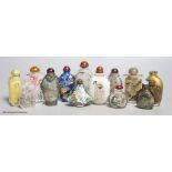 Eleven Chinese painted glass snuff bottles, a glass enamel one and another enamel one