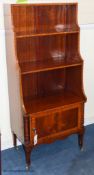 A Sheraton revival inlaid mahogany waterfall bookcase, 114.5 cm height, 51 cm wide, 30.5 cm