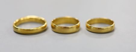 Three assorted 22ct gold wedding bands,14.5 grams.