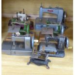 Seven miniature sewing machines