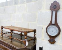 An oak footstool, width 76cm, depth 30cm, height 27cm and an aneroid barometer, length 58cm, width