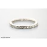 A white metal and diamond chip set full eternity ring, size L, gross 2.2 grams.