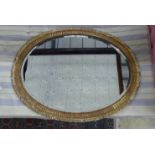 A large George III oval giltwood mirror, width 109cm, height 84cm