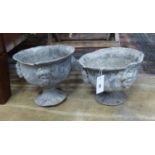 A pair of early 20th century lead garden urns, diameter 26cm, height 23cm