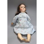 An A M 390 Bisque head doll, stamped AM, open mouth,