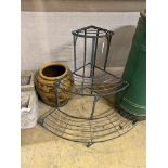 A wrought iron three tier plant stand, height 75cm and a tin glazed vase,
