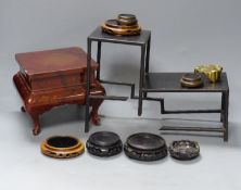 A group of Chinese wooden and bronze stands, tallest 15cm