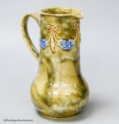 A Royal Doulton green stoneware jug, 17cm