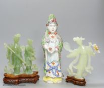 A pair of cased Chinese bowenite jade figure carvings and a porcelain figure of Guanyin, height