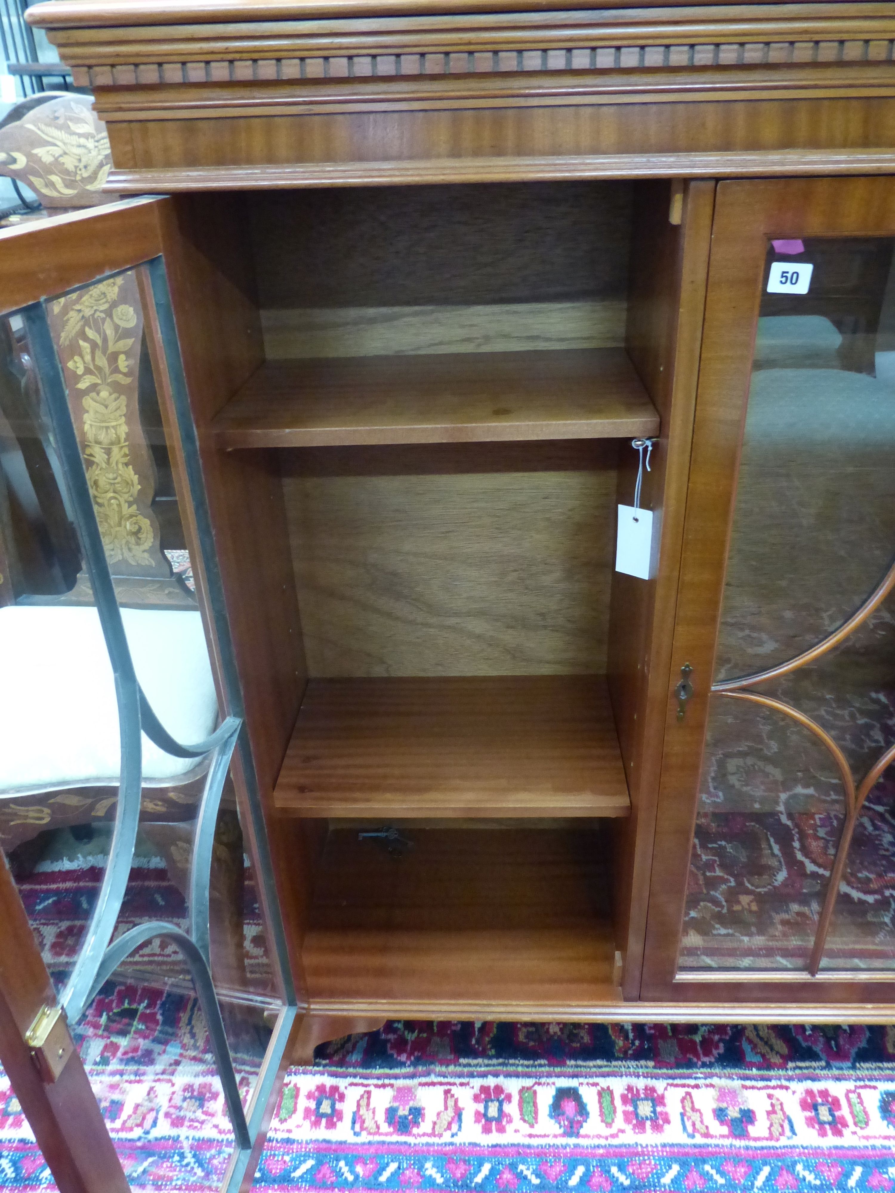 A reproduction mahogany three door bookcase, width 135cm depth 33cm height 116cm - Image 5 of 5