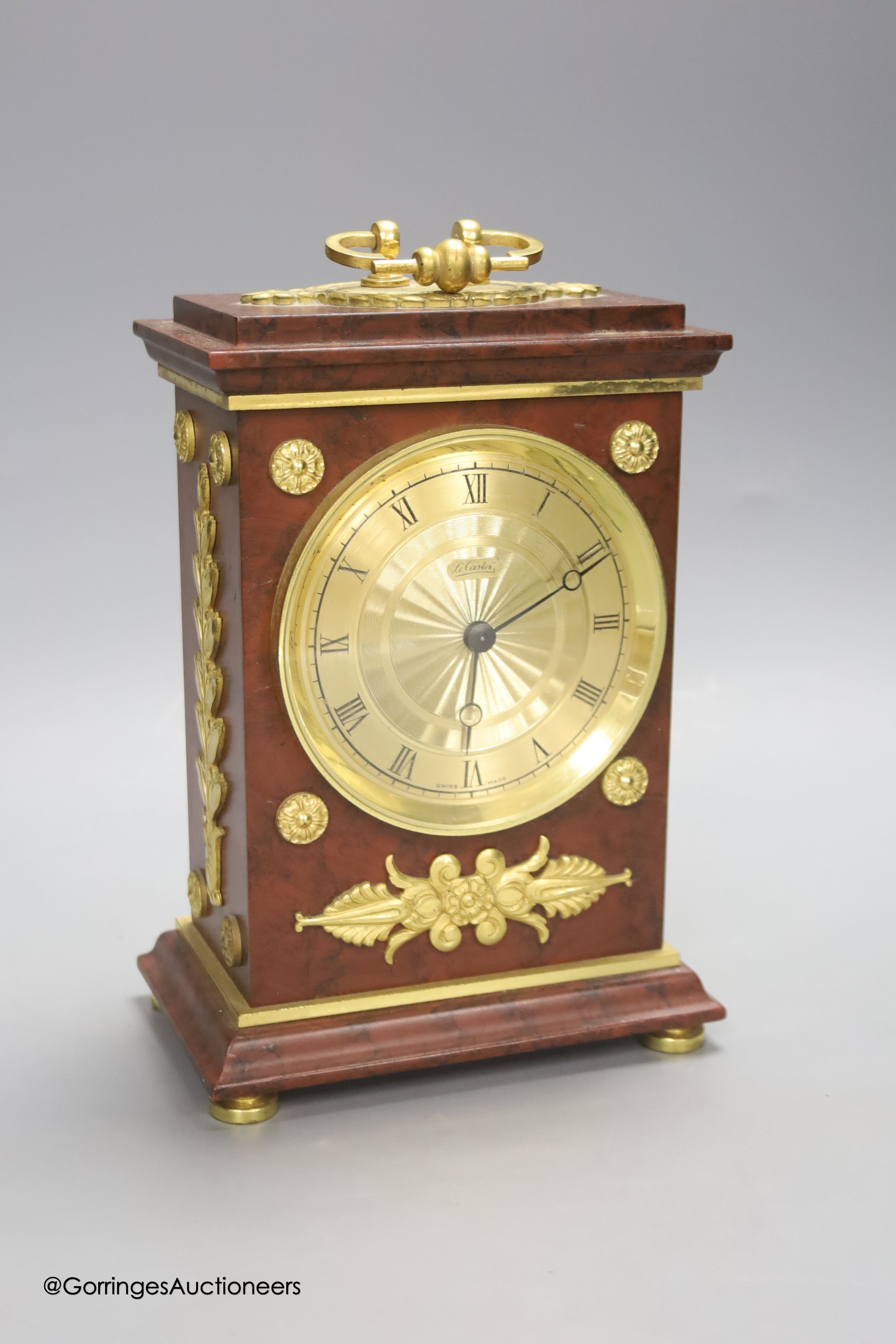 A Le Castel faux marble mantel clock, height 24cm