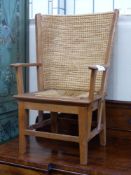 A 20th century light oak and skep work child's Orkney chair in traditional style, width 54cm, depth