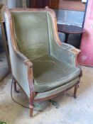 A Louis XVI style walnut framed fauteuil, with green dralon upholstery, width 67cm, depth 56cm,