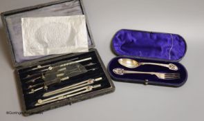 A cased Victorian silver christening spoon and fork, with pierced terminals, Jehoiada Alsop Rhodes,