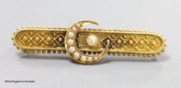 A late Victorian yellow metal and seed pearl set bar brooch, with crescent motif, 46mm, gross