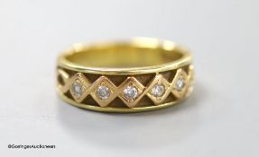 An 18ct gold five-stone diamond ring,the old cut diamonds in claw-set lozenge-shaped settings, size