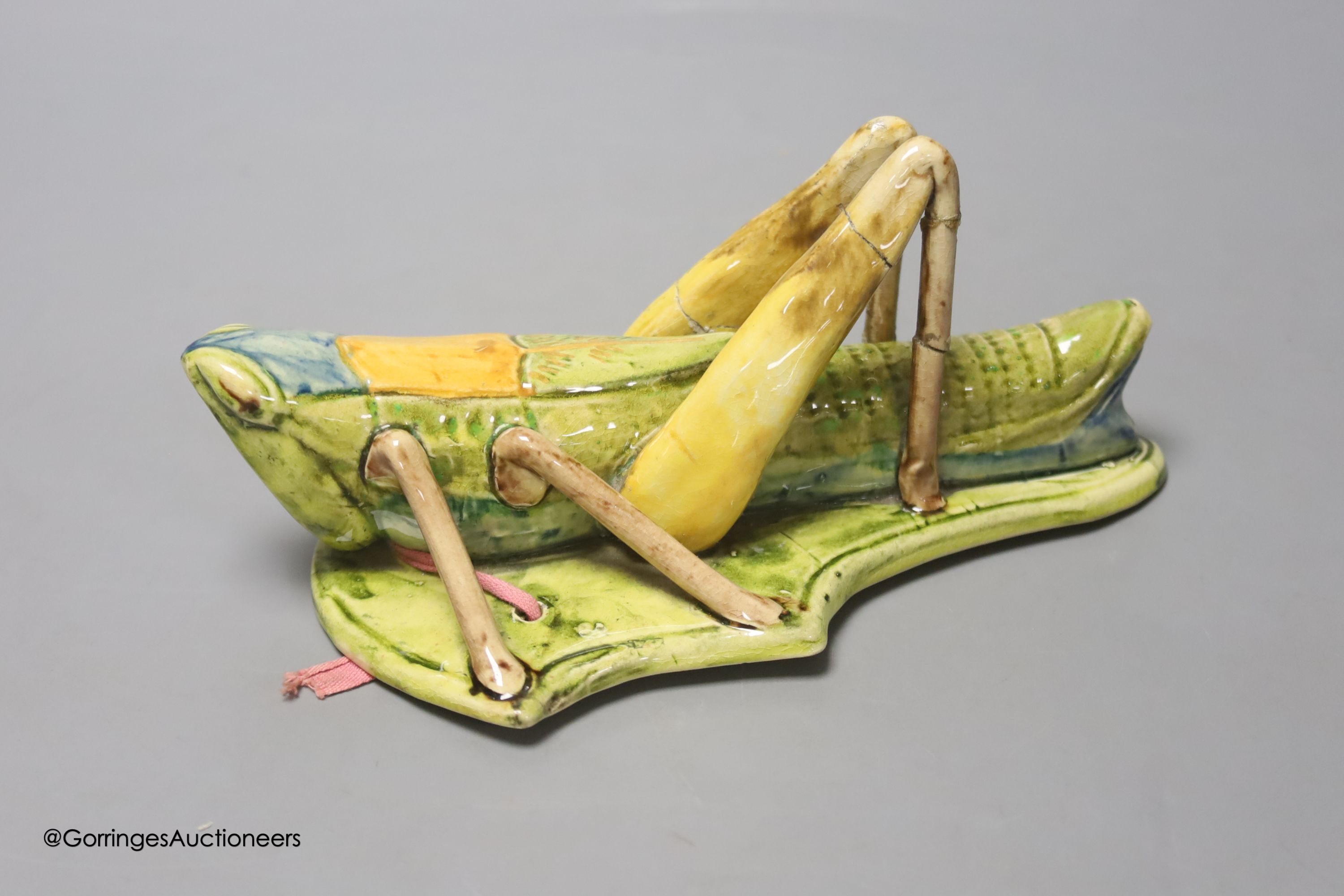 A Continental pottery 'grasshopper' wall pocket, early 20th century, possibly Caldas da Rainha,