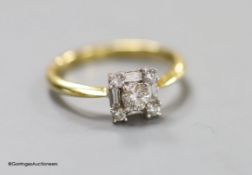 A modern 18ct gold, round and baguette cut diamond set square cluster ring, size N, gross 2.8