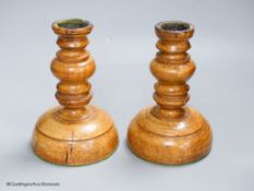 A pair of turned Treen candlesticks, height 17cm