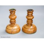 A pair of turned Treen candlesticks, height 17cm