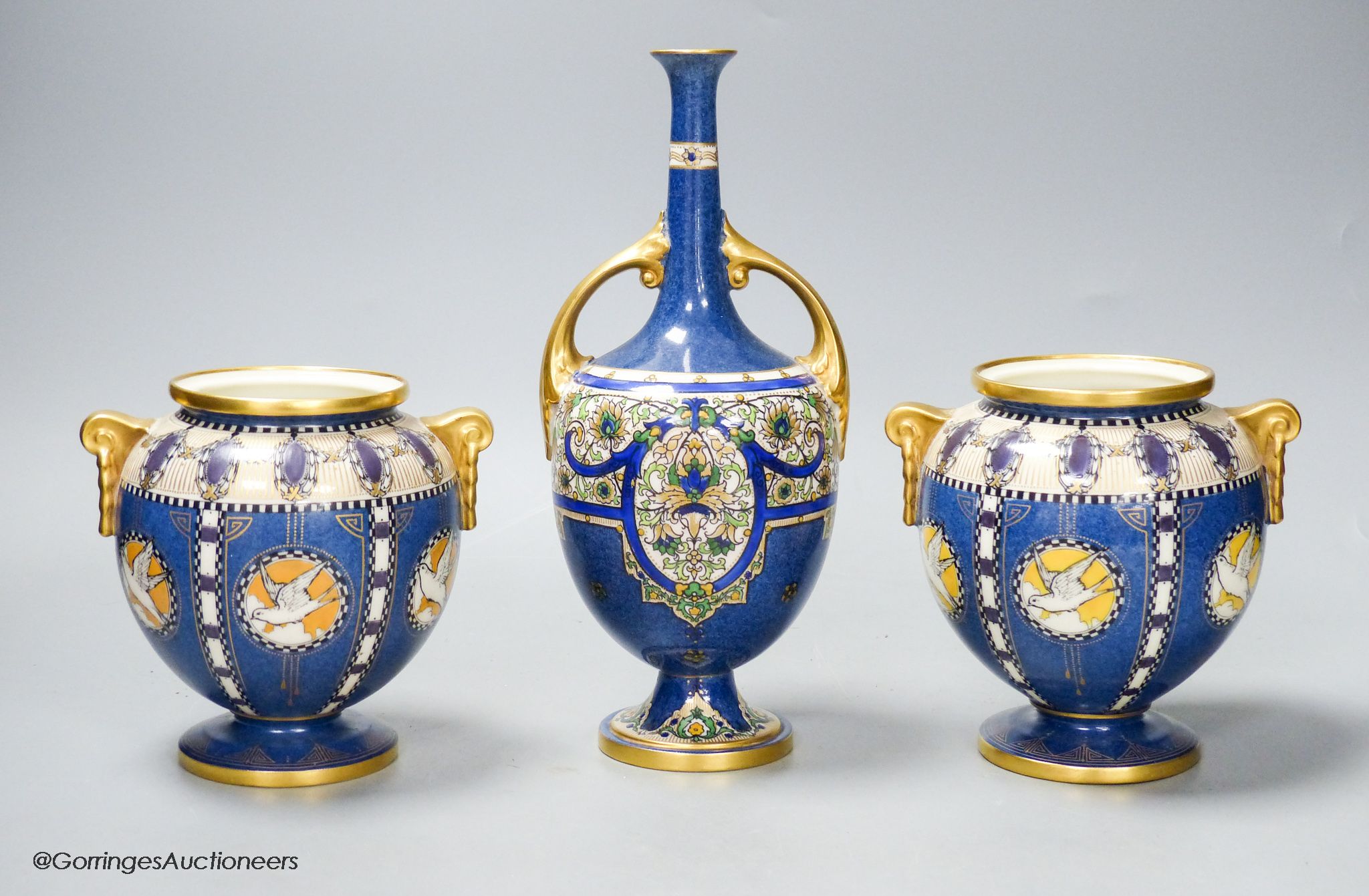 A pair of Royal Worcester powder blue vases and another similar vase, height 23cm