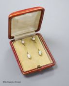 A pair of 9ct and two stone white opal set drop earrings, 36mm, gross 2.9 grams (one of the appears