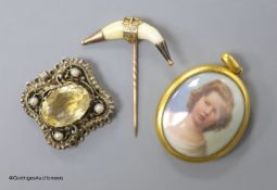 A Victorian yellow metal mounted glazed oval pendant, with miniature portrait of a young lady and