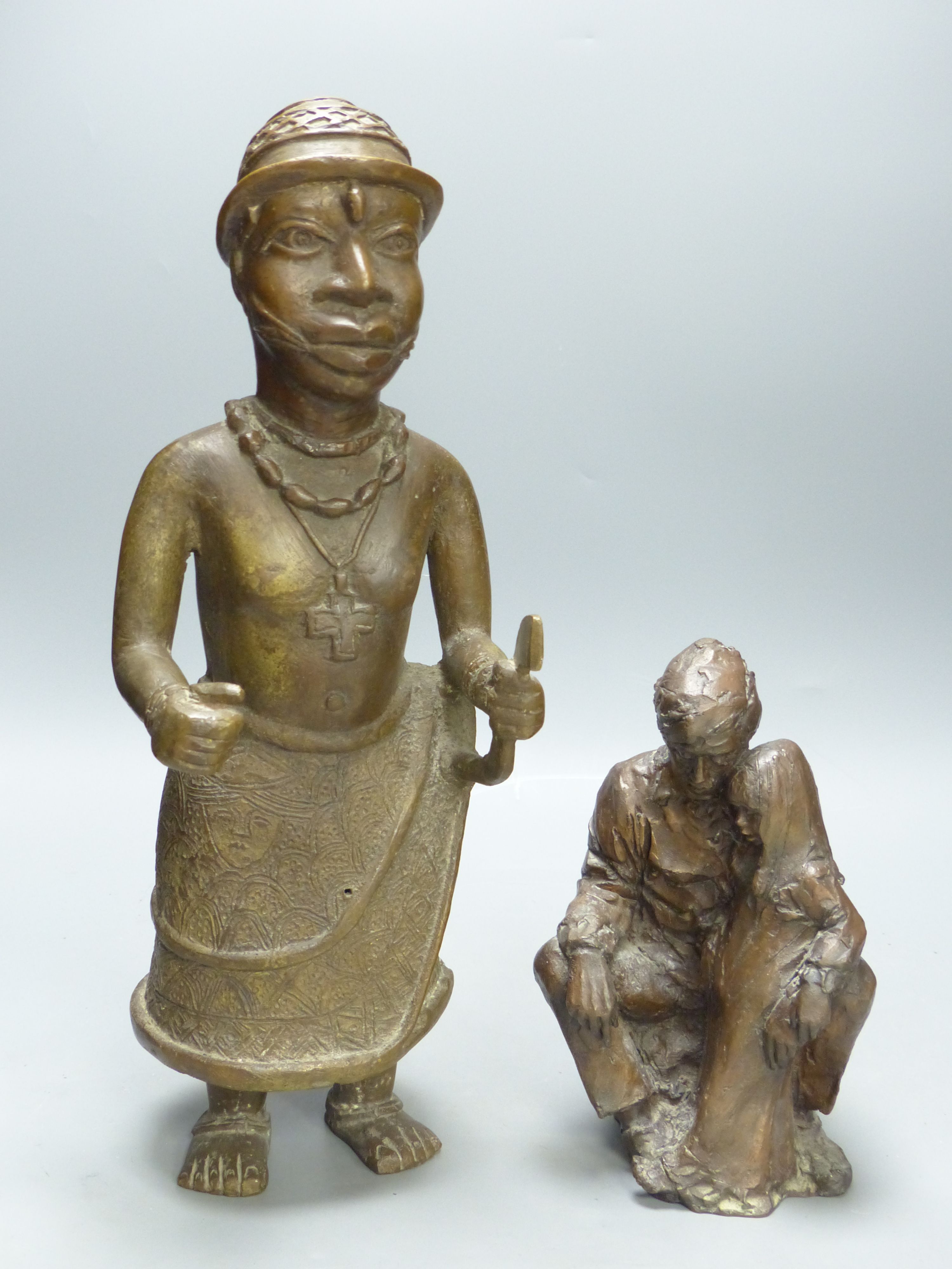 An African bronze figure and a modern bronze figure group