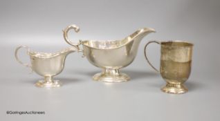 A Victorian silver cream boat, a small silver pedestal helmet cream jug and a silver Christening