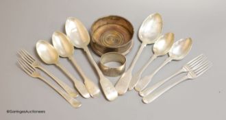 Four George III silver forks, six spoons, a later bottle coaster and a napkin ring,weighable silver