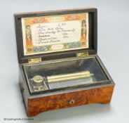 A small Swiss amboyna six air cylinder musical box