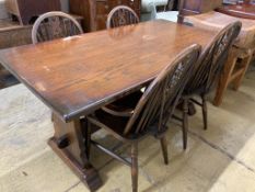 A 17th century style oak 'refectory' table on shaped trestle end supports, length 160cm, depth