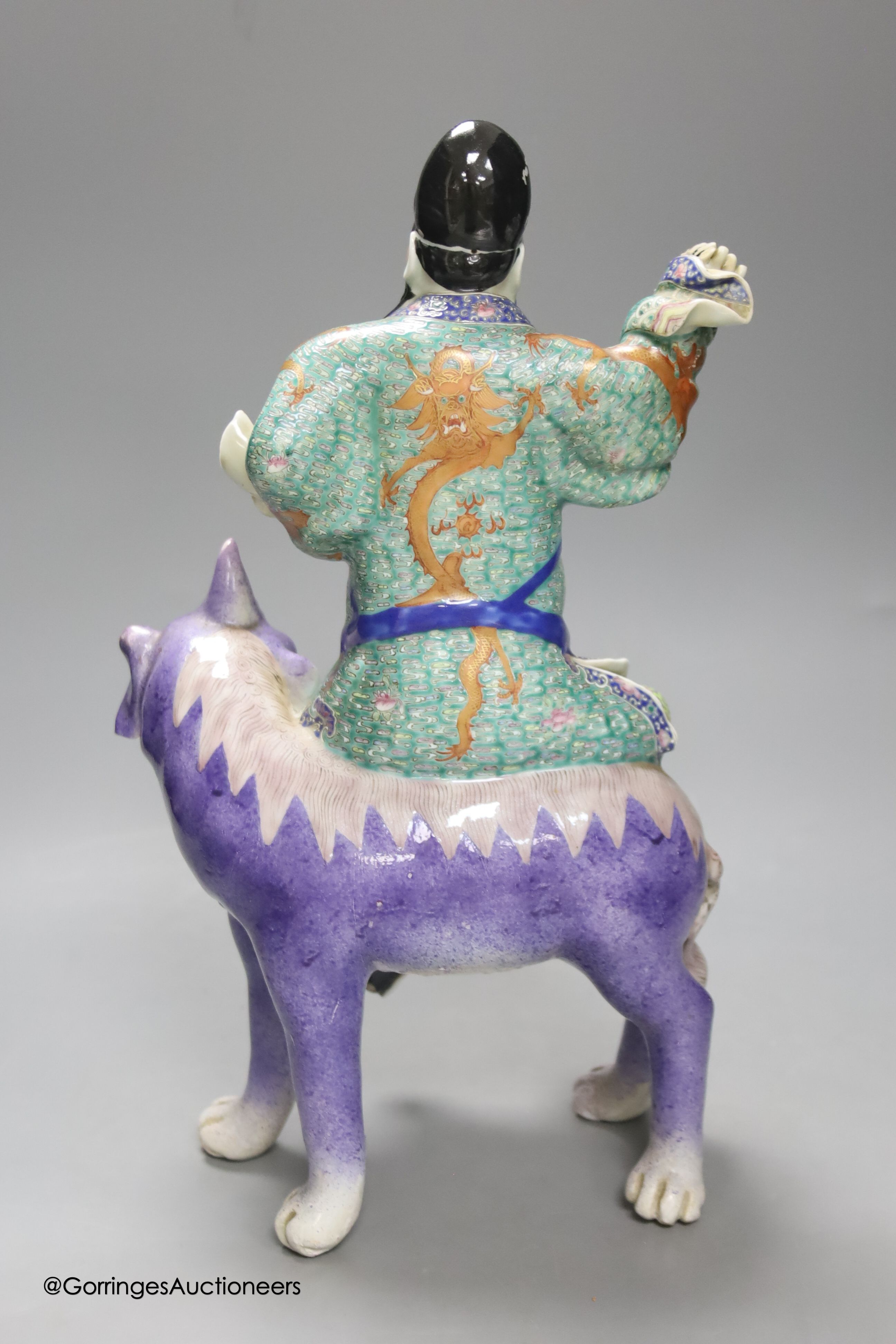 A Chinese enamelled porcelain figure group of an immortal on a mythical beast, Republic period, - Image 2 of 3