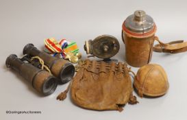 A leather cased flask and cups, various WWI and WWII medals, binoculars and a fishing reel
