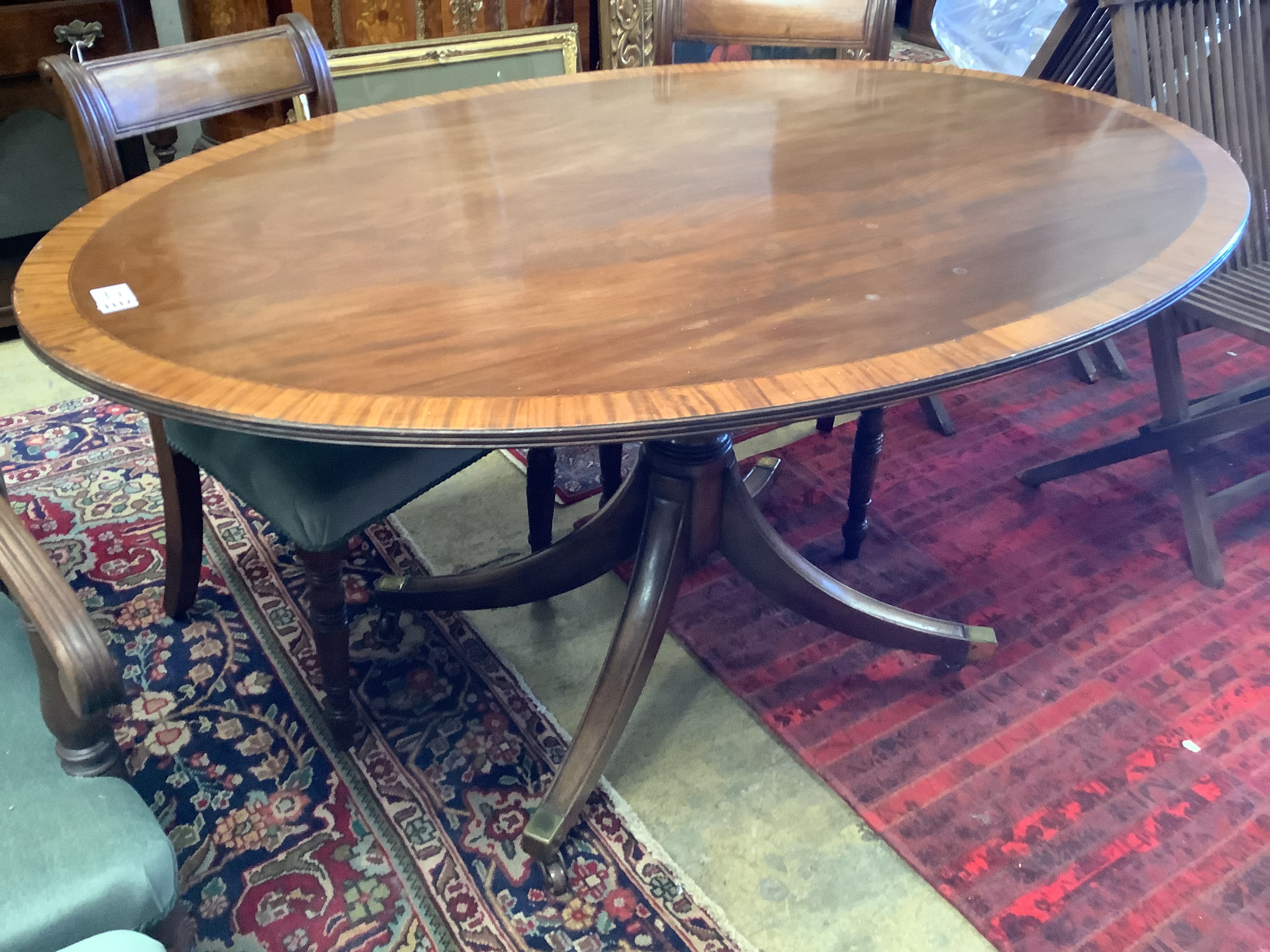 A Regency style oval banded mahogany dining table, length 150cm, depth 103cm, height 76cm - Image 4 of 8