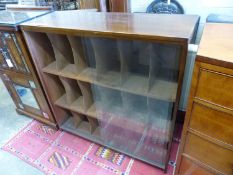 A mid century glazed teak eighteen section record cabinet, length 104cm, depth 35cm, height 104cm