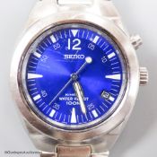 A gentleman's modern stainless steel Seiko Kinetic Waterproof 100M wrist watch, with blue dial, on