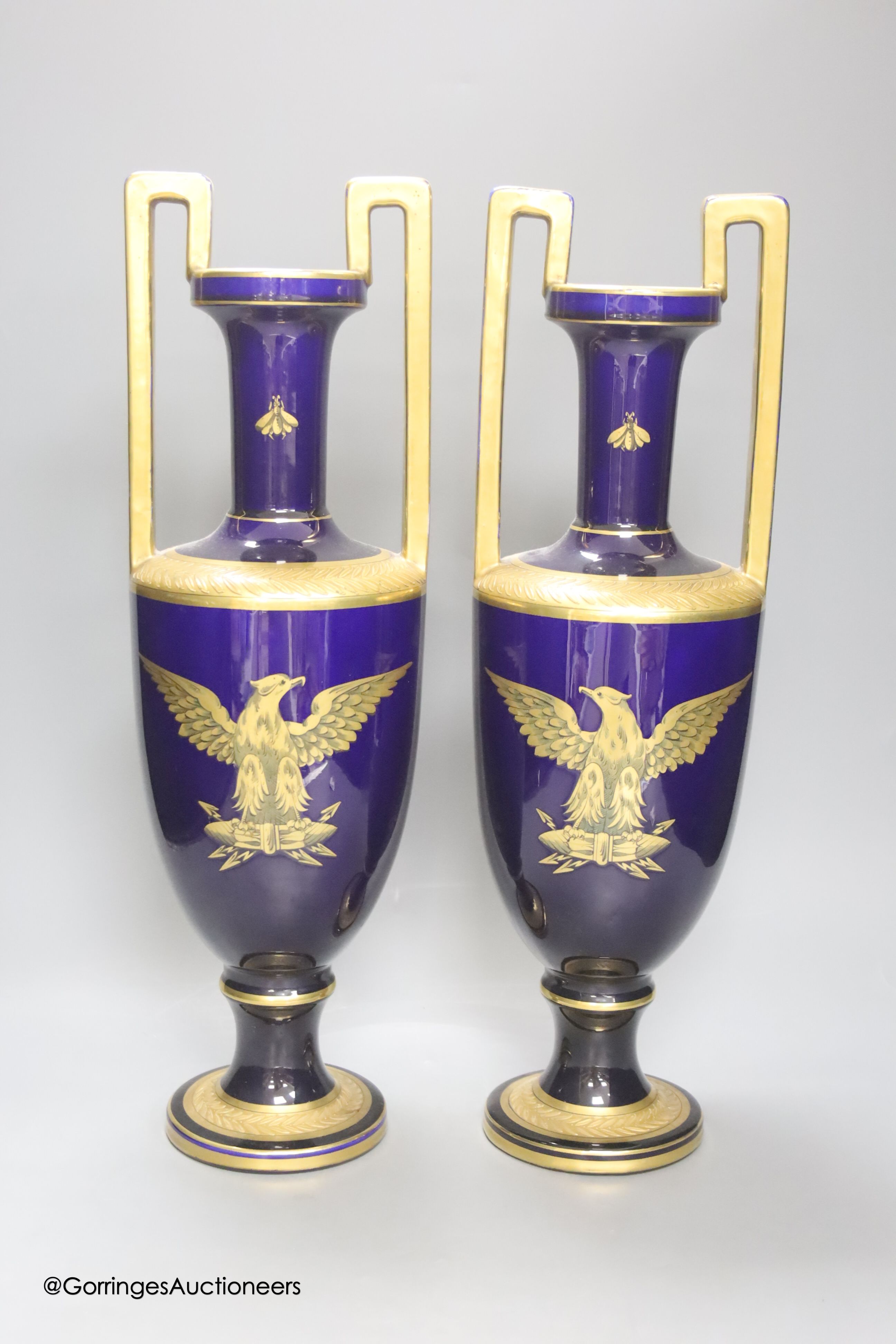 A pair of French gilt blue porcelain two handled vases, height 45cm