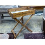 'The Bee Hive Stores', a rectangular wooden produce display tray on folding stand, width 65cm,