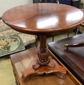 A William IV style mahogany tilt-top centre tableraised on single column and trefoil slab base with