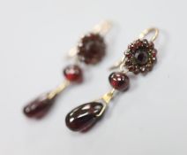 A pair of late Victorian gilt white metal?, facet, bead and pear shaped garnet set drop earrings,